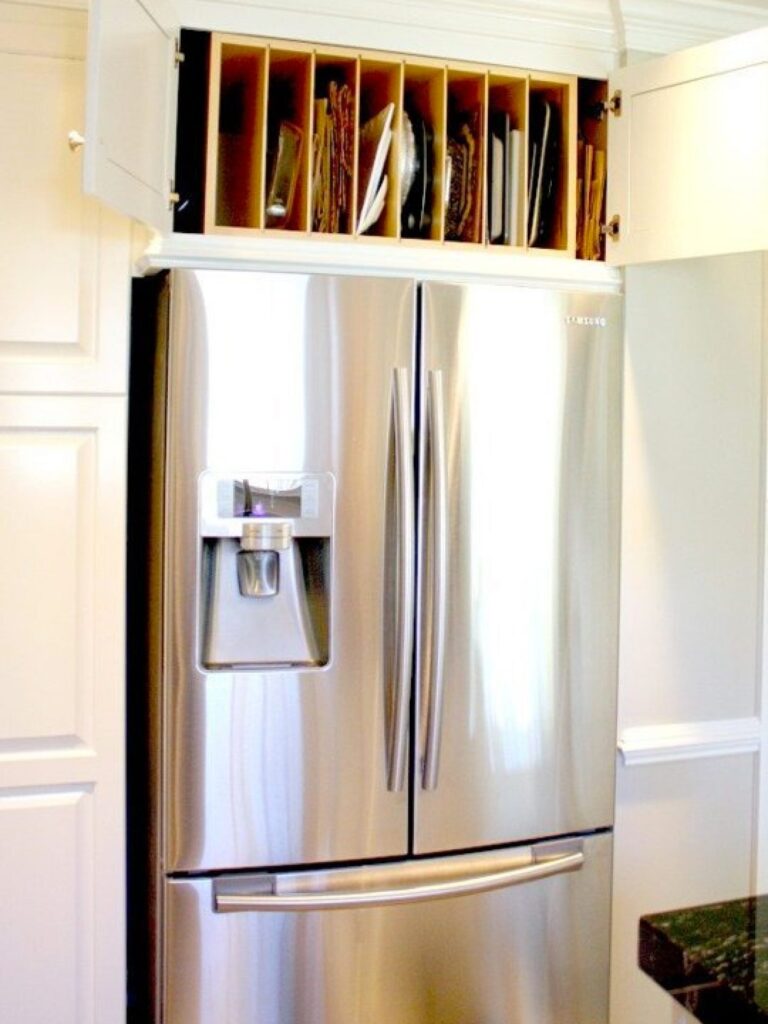 silver color fridge with cabinet