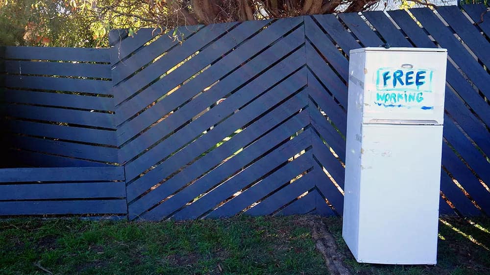 a fridge placed on ground for free donation