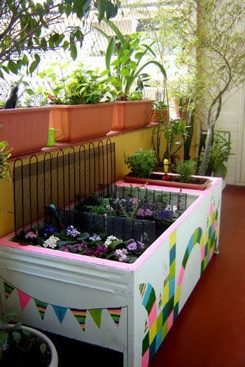 old refrigerator turned into plant pots holder