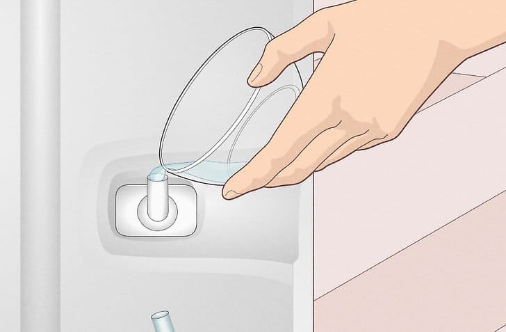 animated image of vinegar and water solution pouring in water lines