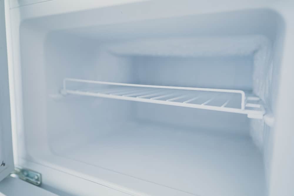 A view of an empty frosty freezer